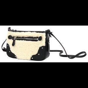 Coach Rhyder leather shearling crossbody.